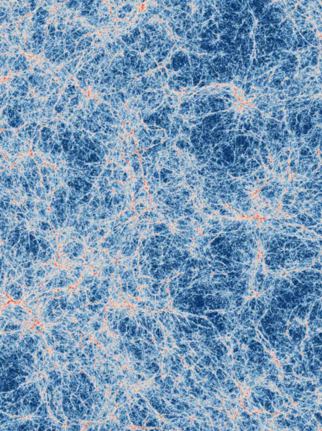 Immagine di un'ampia regione dell’universo come predetta da simulazioni basate sul modello cosmologico attuale e condotte con super computer. Nell’immagine osserviamo, in bianco, il tenue bagliore del gas presente nei filamenti cosmici che disegna una fitta trama cosmica. All’intersezione di questi filamenti, in rosso, è visibile il gas all’interno delle galassie, che dà vita a nuove stelle. Credito: Alejandro Benitez-Llambay/Università di Milano-Bicocca