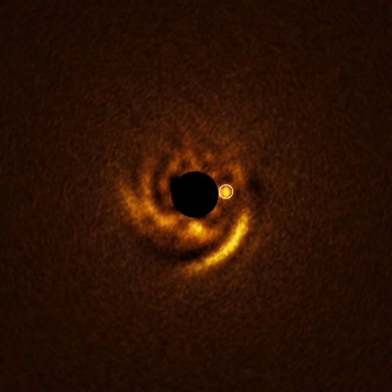 Astronomers witness still-forming planet sculpting the dust around it, near the star HD 135344B This image, taken with ESO’s Very Large Telescope (VLT), shows a spiral disc around the young star HD 135344B. The image was obtained with the VLT’s Enhanced Resolution Imager and Spectrograph (ERIS) instrument, which found a candidate planet that may be sculpting the spiral features in the disc. The location of this planet is indicated with a white circle. The central black circle corresponds to a coronagraph — a device that blocks the light of the star to reveal faint details around it. Credit: ESO/F. Maio et al.